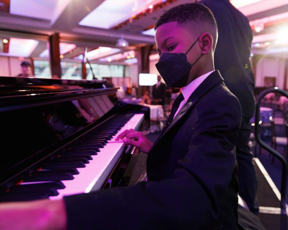 Kai Brown Coley played the piano at the 30th Annual Ronald McDonald House New York Gala in October 2022