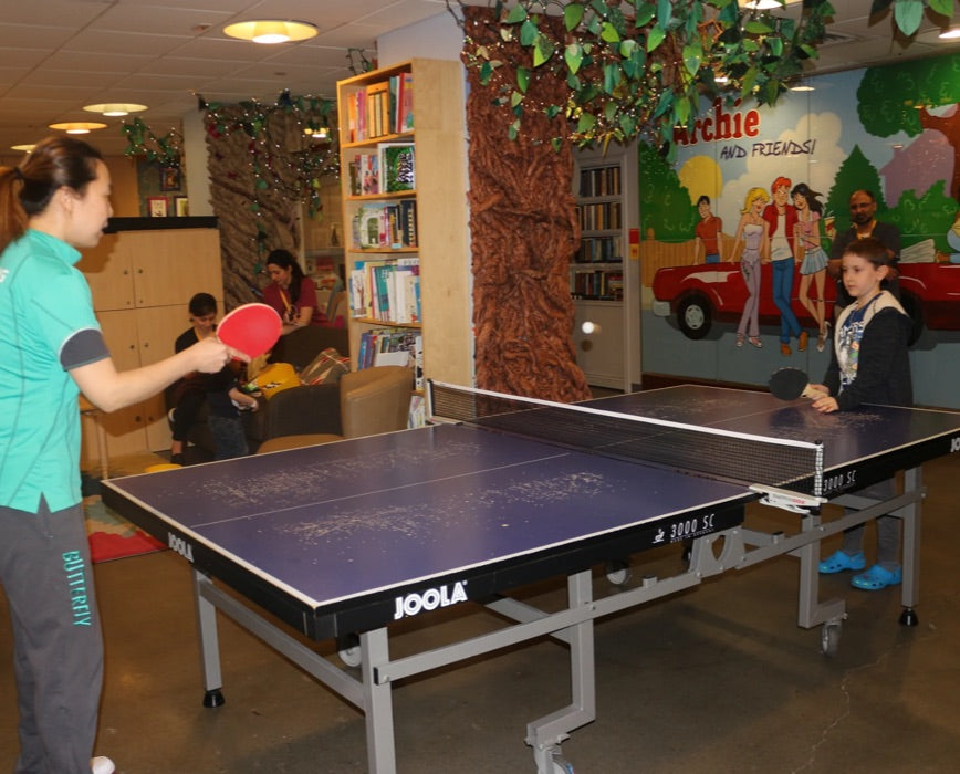 children playing ping pong
