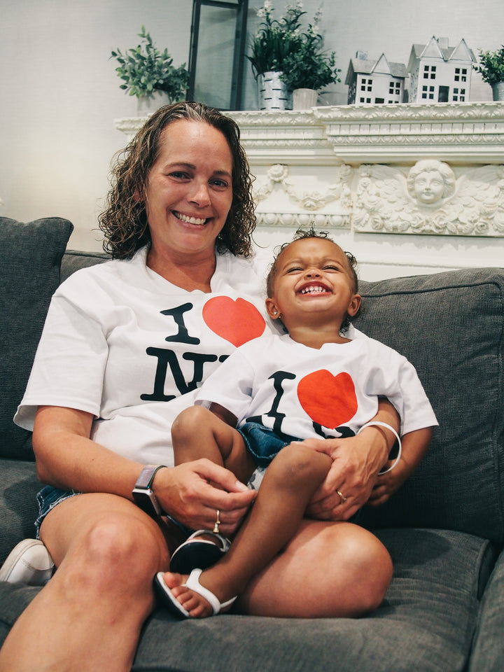 Little girl with cancer laughing with Mom at Ronald McDonald House New York