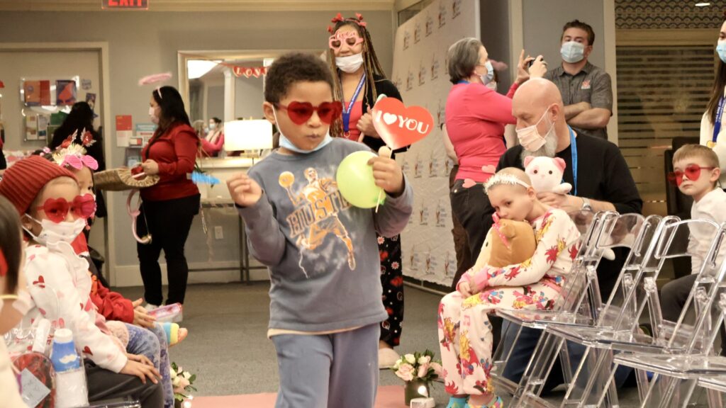 Kids walk the runway after