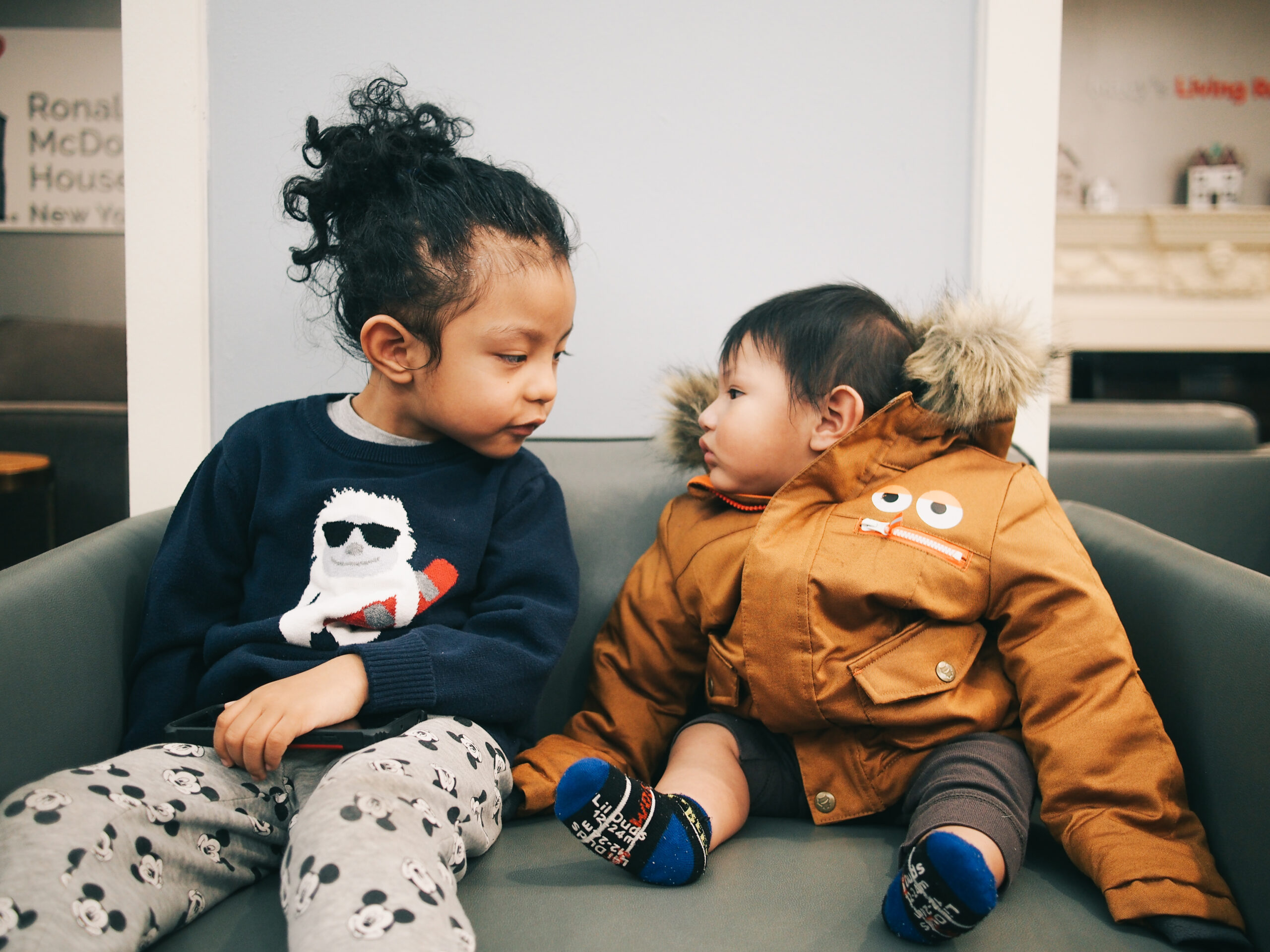 Two brothers in a staring content at the House