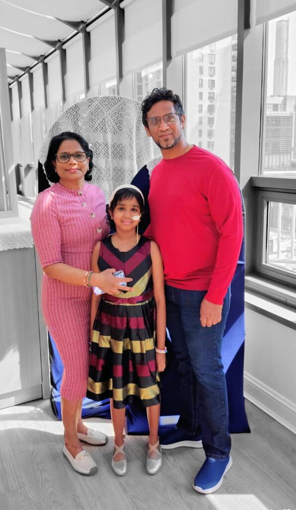 Haimdat and Angelique with Angelica their daughter in the Wellness center in the House.