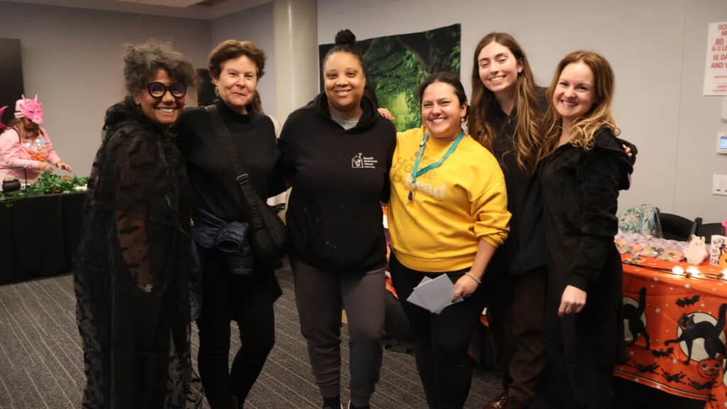 Stefanie is pictured here with her Programs colleagues in yellow.
