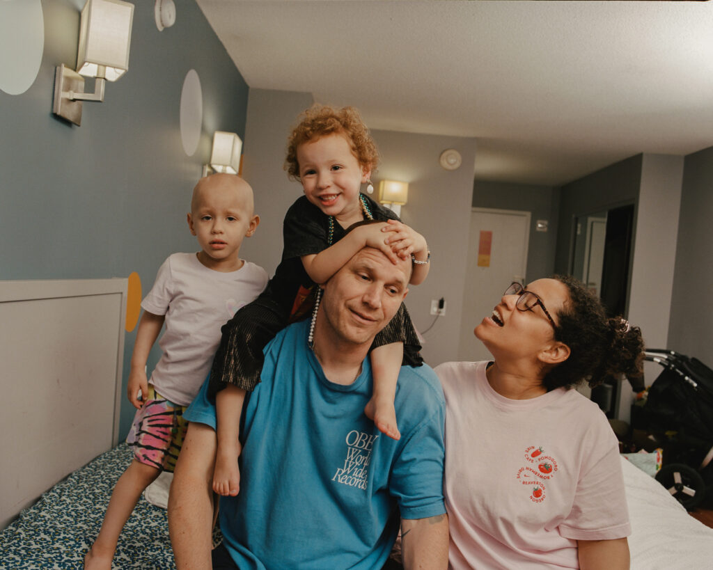 The King Family before bed in their room at Ronald McDonald House New York having time together.
