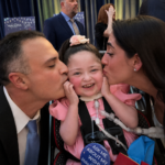 Mom and Dad kissing Sofia