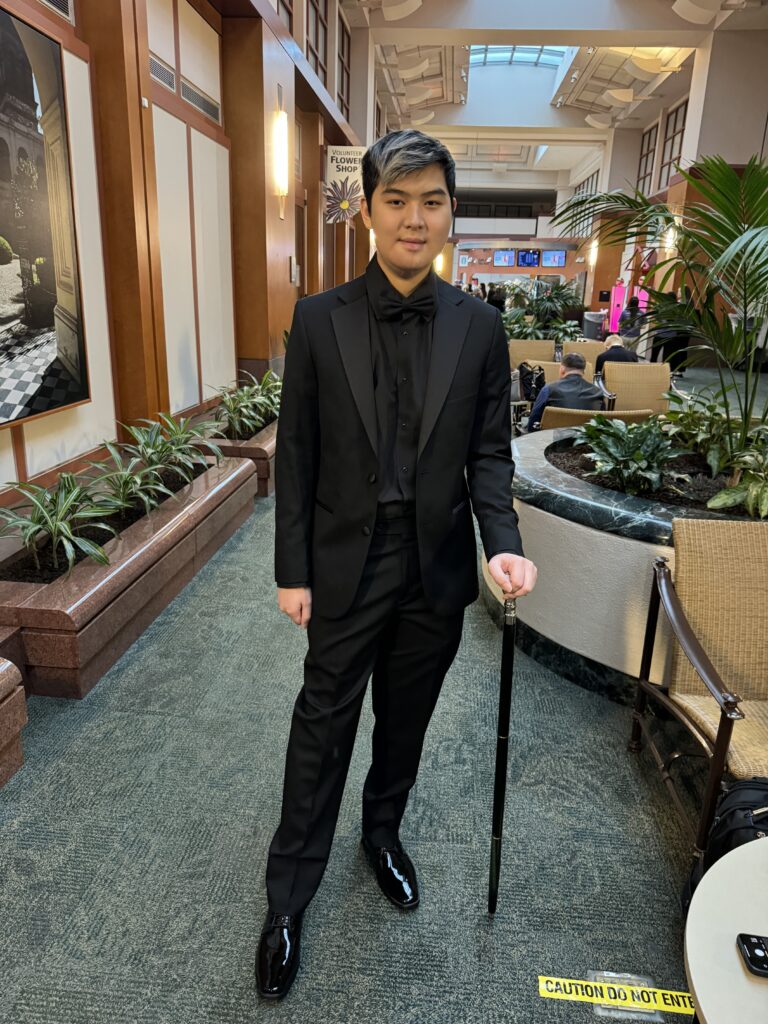 Connor Chin in black suit
