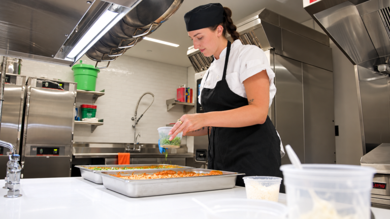 Chef Darby making food in the new kitchen.