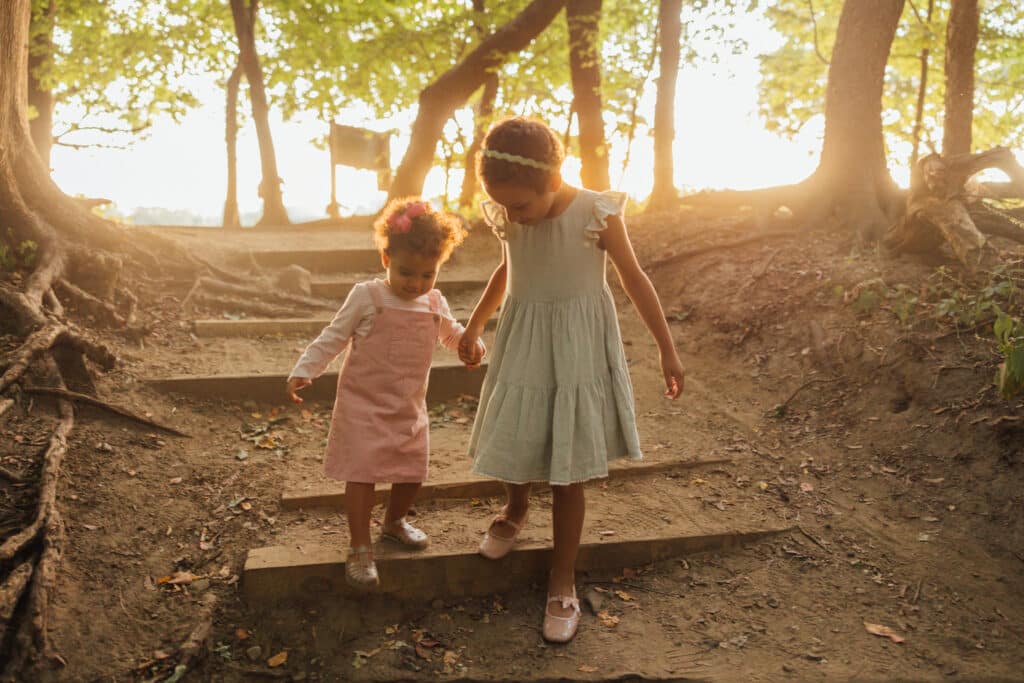 Alessia and Vida running through the woods