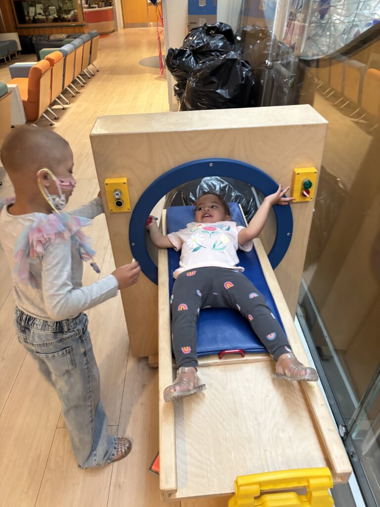 Alessia and Vida slide on the pklayground