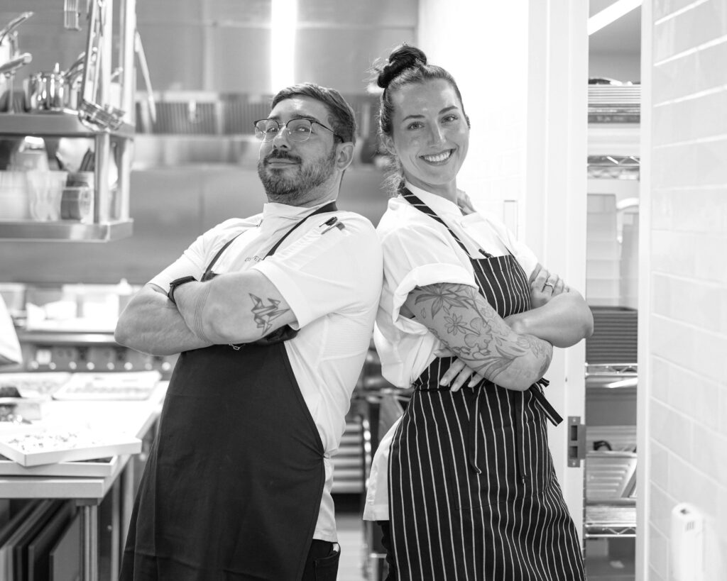Darby with a volunteer in the kitchen